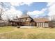 Expansive backyard featuring a covered patio, a basketball hoop, and ample green space at 12107 Castle Row Overlook, Carmel, IN 46033