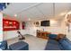 Finished basement with a kitchenette, lounge area, and television, perfect for entertaining at 12107 Castle Row Overlook, Carmel, IN 46033