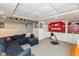 Finished basement with kitchenette, comfortable seating, and ample recreational space at 12107 Castle Row Overlook, Carmel, IN 46033