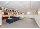 Spacious finished basement area with carpet, recessed lighting, and ample space for recreation and entertainment at 12107 Castle Row Overlook, Carmel, IN 46033