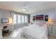 Bright bedroom with large windows, soft color palette, and cozy furniture at 12107 Castle Row Overlook, Carmel, IN 46033