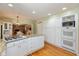 Spacious kitchen featuring white cabinets, granite countertops, stainless steel appliances, and a gas cooktop at 12107 Castle Row Overlook, Carmel, IN 46033