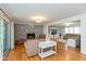 Inviting living room with a brick fireplace, hardwood floors, and an open layout at 12107 Castle Row Overlook, Carmel, IN 46033