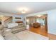 Spacious living room featuring hardwood flooring, crown molding, and an open floor plan at 12107 Castle Row Overlook, Carmel, IN 46033