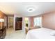 Bright main bedroom featuring a TV over a dresser, and access to an ensuite bathroom at 12107 Castle Row Overlook, Carmel, IN 46033