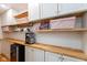 Pantry with wooden countertops and shelves, coffee maker, coffee mugs and decorative accents at 12107 Castle Row Overlook, Carmel, IN 46033