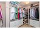 Well-organized walk-in closet with custom shelving, drawers, and ample storage space for shoes and clothing at 12107 Castle Row Overlook, Carmel, IN 46033