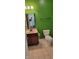 Bathroom with a vanity, mirror, toilet, and bright green walls at 1223 Blackthorne S Trl, Plainfield, IN 46168