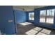 Bright bedroom featuring two windows, neutral carpet, and a ceiling fan at 1223 Blackthorne S Trl, Plainfield, IN 46168