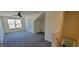 Bonus room featuring carpet and a view of the home's staircase at 1223 Blackthorne S Trl, Plainfield, IN 46168