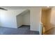Bonus room with carpet and a view of the home's staircase at 1223 Blackthorne S Trl, Plainfield, IN 46168