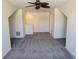 Bonus room featuring carpet and a view of the home's staircase at 1223 Blackthorne S Trl, Plainfield, IN 46168