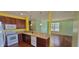 Modern kitchen boasts stainless steel appliances, dark wood cabinets, granite countertops and view to living area at 1223 Blackthorne S Trl, Plainfield, IN 46168