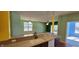 Open kitchen design with granite countertops and view into adjacent rooms with abundant natural light at 1223 Blackthorne S Trl, Plainfield, IN 46168