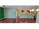 Spacious living room with hardwood floors flowing into an open kitchen space at 1223 Blackthorne S Trl, Plainfield, IN 46168