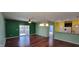 Living room with a sliding glass door to a patio and hardwood floors at 1223 Blackthorne S Trl, Plainfield, IN 46168
