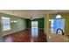 Open-concept living area with hardwood floors and a view of the outdoor space at 1223 Blackthorne S Trl, Plainfield, IN 46168