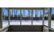 A screened-in patio with a view of the snowy outdoors brings nature to your doorstep at 1223 Blackthorne S Trl, Plainfield, IN 46168