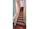 Carpeted staircase with white railing in the home at 1223 Blackthorne S Trl, Plainfield, IN 46168
