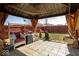 Backyard view of patio space including patio furniture and a swing at 12329 Wolf Run Rd, Noblesville, IN 46060