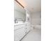 Bright bathroom featuring double sinks, white cabinets, and tile floors at 12329 Wolf Run Rd, Noblesville, IN 46060