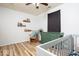Bedroom features wood-look floors, a rocking chair, a dresser, and a crib at 12329 Wolf Run Rd, Noblesville, IN 46060
