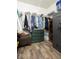 Walk in closet with custom shelving, dresser, and safe at 12329 Wolf Run Rd, Noblesville, IN 46060
