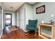 Inviting entryway with hardwood floors and a comfortable rocking chair at 12329 Wolf Run Rd, Noblesville, IN 46060