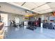 Spacious home garage featuring an exercise area and storage shelves at 12329 Wolf Run Rd, Noblesville, IN 46060