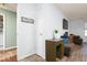 Hallway view with a desk, chair, and a view of the laundry room at 12329 Wolf Run Rd, Noblesville, IN 46060