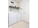 Laundry room with washer, dryer, shelving, and access to the exterior at 12329 Wolf Run Rd, Noblesville, IN 46060