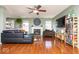 Inviting living room with fireplace, hardwood floors, and comfortable seating at 12329 Wolf Run Rd, Noblesville, IN 46060