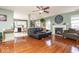 Spacious living room with hardwood floors, fireplace, and open access to kitchen at 12329 Wolf Run Rd, Noblesville, IN 46060