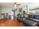 Open-concept living room with a view into the kitchen and comfortable furniture at 12329 Wolf Run Rd, Noblesville, IN 46060
