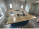 Bright kitchen featuring a center island with sink and butcher block countertops at 1330 Lasalle St, Indianapolis, IN 46201