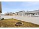 Fenced backyard with a fire pit, offering privacy and outdoor enjoyment at 13332 N Brick Chapel Dr, Camby, IN 46113