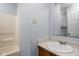 Neutral bathroom features a shower, white vanity, and a large mirror at 13332 N Brick Chapel Dr, Camby, IN 46113