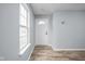 Bright entryway with wood-look flooring and a white front door at 13332 N Brick Chapel Dr, Camby, IN 46113