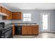 Practical kitchen setup featuring efficient layout, neutral walls, and modern flooring at 13332 N Brick Chapel Dr, Camby, IN 46113