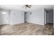 Neutral-toned living room showcasing the front door and multiple doorways at 13332 N Brick Chapel Dr, Camby, IN 46113