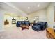 Finished basement featuring plush sofas, coffee table, and treadmill at 14020 Quarter Horse Ct, Carmel, IN 46032