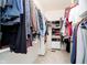 Walk-in closet features custom shelving, hanging racks, and ample storage space at 14020 Quarter Horse Ct, Carmel, IN 46032