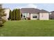 Beautiful exterior of home with well-manicured lawn and mature trees at 14020 Quarter Horse Ct, Carmel, IN 46032