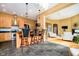 Open kitchen with a breakfast bar overlooking the living room and stainless appliances at 14020 Quarter Horse Ct, Carmel, IN 46032