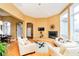 Open-concept living room featuring a fireplace and an archway to other living spaces at 14020 Quarter Horse Ct, Carmel, IN 46032
