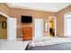 Spacious main bedroom featuring a large window providing plenty of natural light and ensuite bathroom at 14020 Quarter Horse Ct, Carmel, IN 46032