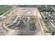 An aerial view of new homes being built in a subdivision with green spaces and modern construction at 1404 Bluebonnet Pl, Shelbyville, IN 46176