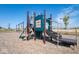 Community playground with swings, slides, and climbing structures for residents at 1404 Bluebonnet Pl, Shelbyville, IN 46176