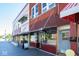 A charming street view showing a variety of store fronts, including a nutrition store and a barber shop at 1404 Bluebonnet Pl, Shelbyville, IN 46176