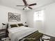 Brightly lit bedroom with modern accents, black and white rug and comfy bench at 1420 E Market St, Indianapolis, IN 46201